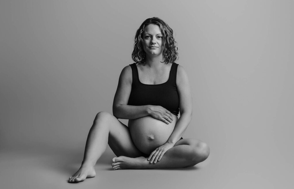 Pregnant woman poses for Studio Maternity Portraits in Asheville, NC. Best Prenatal Yoga in Asheville.