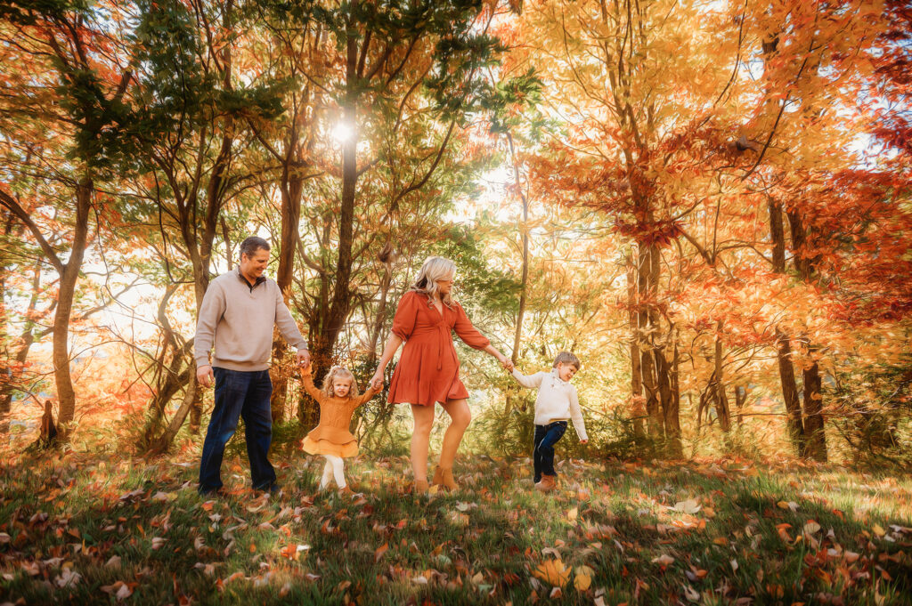 Family walks along the Blue Ridge Parkway together during the fall in Asheville, NC. 