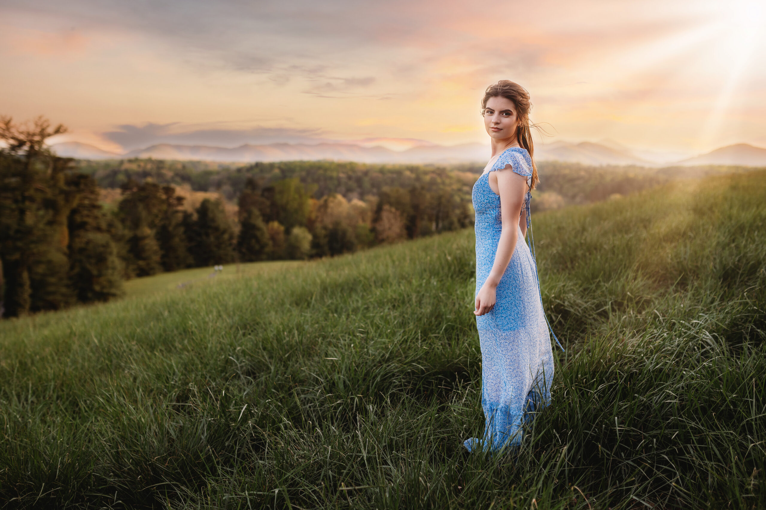Young woman poses for Senior Photos at Biltmore Estate in Asheville, NC.