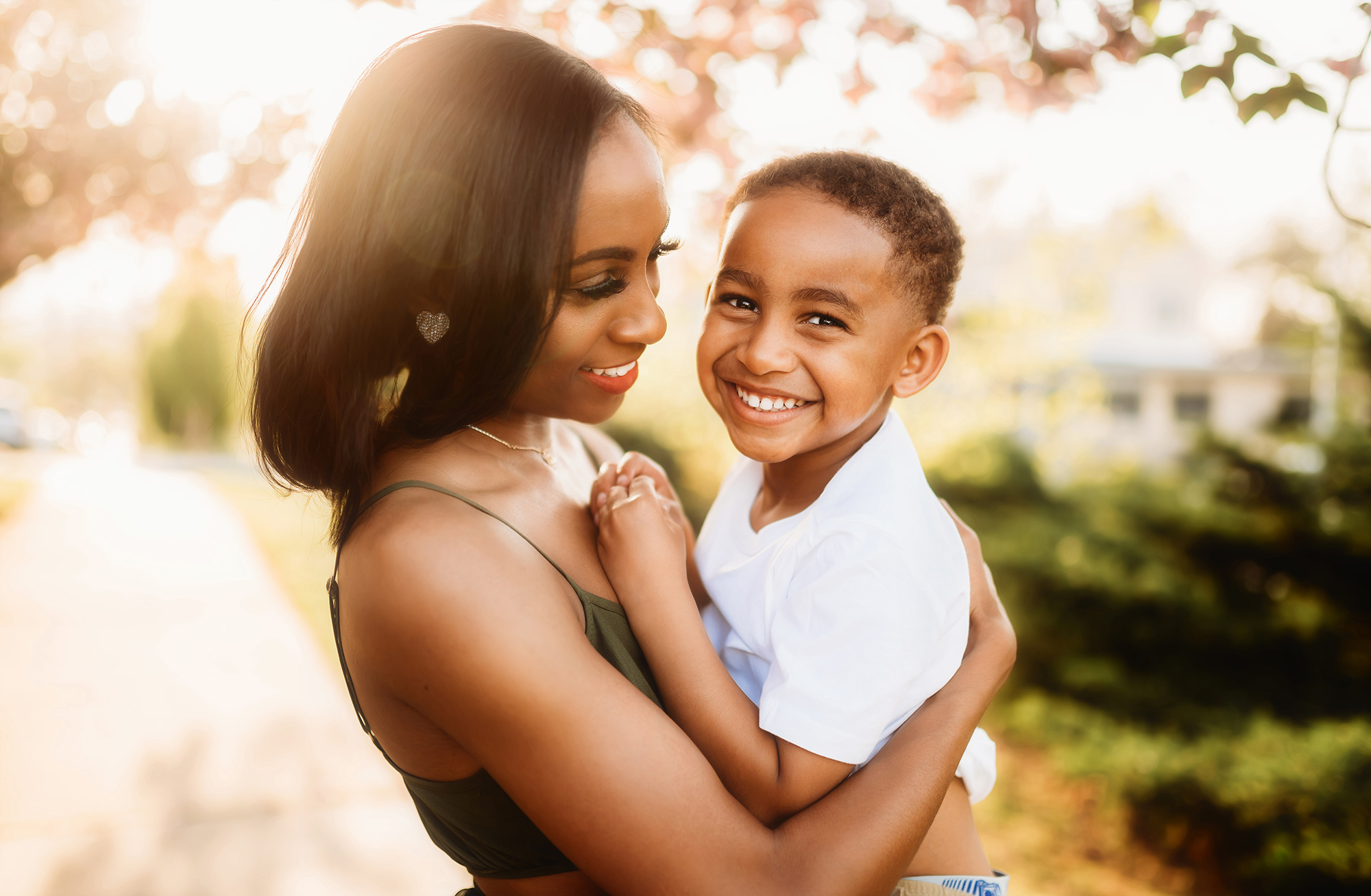 Mother embraces her son during Mother's Day Mini Session in Asheville, NC.