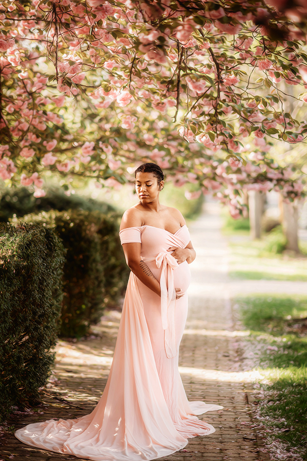 Expectant Mother poses for Maternity Portraits in the Spring in Asheville, NC.