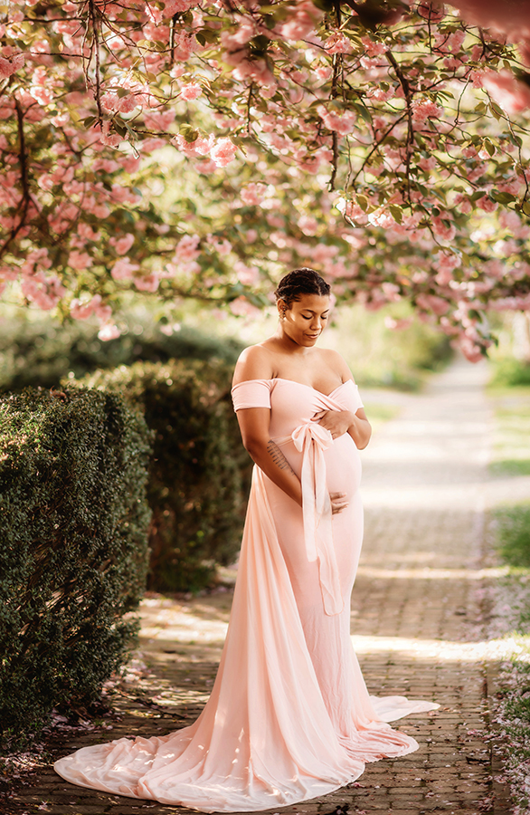 Expectant Mother poses for Maternity Portraits in the Spring in Asheville, NC.