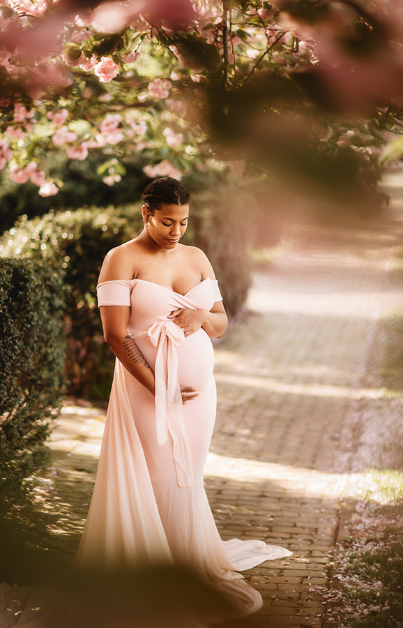 Expectant Mother poses for Maternity Portraits in the Spring in Asheville, NC.