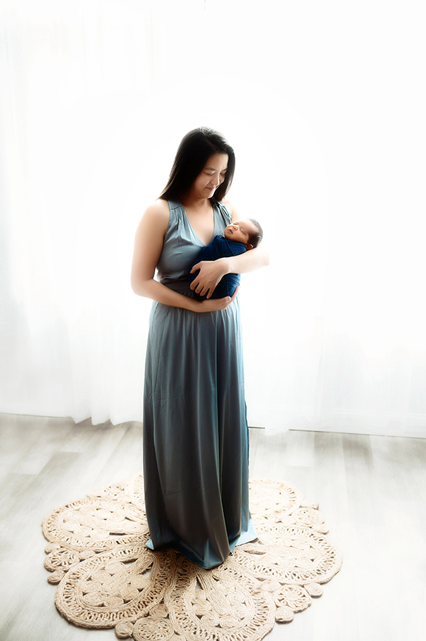 Newborn Baby posed with his mother for Newborn Portrait Session at Asheville, NC Newborn Photography Studio.