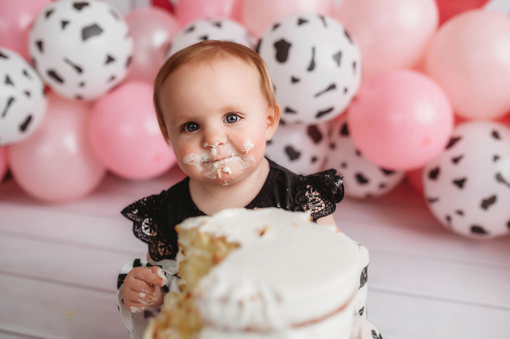 Baby poses for her Cake Smash in Asheville, NC.