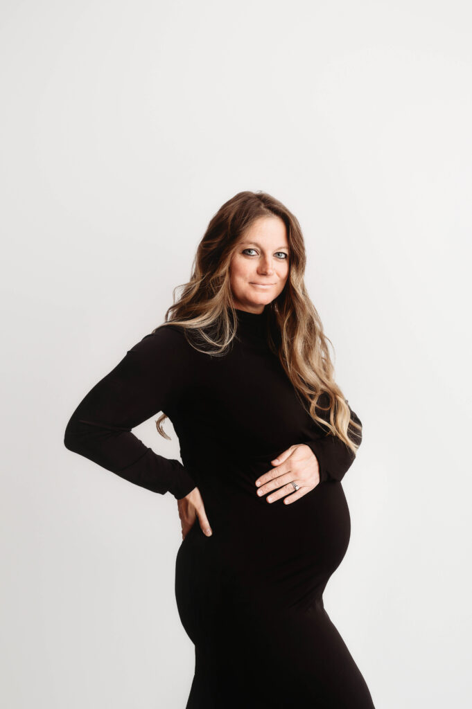 Pregnant woman poses for Studio Maternity Portraits in Asheville, NC and discusses Asheville's Best OBGYN