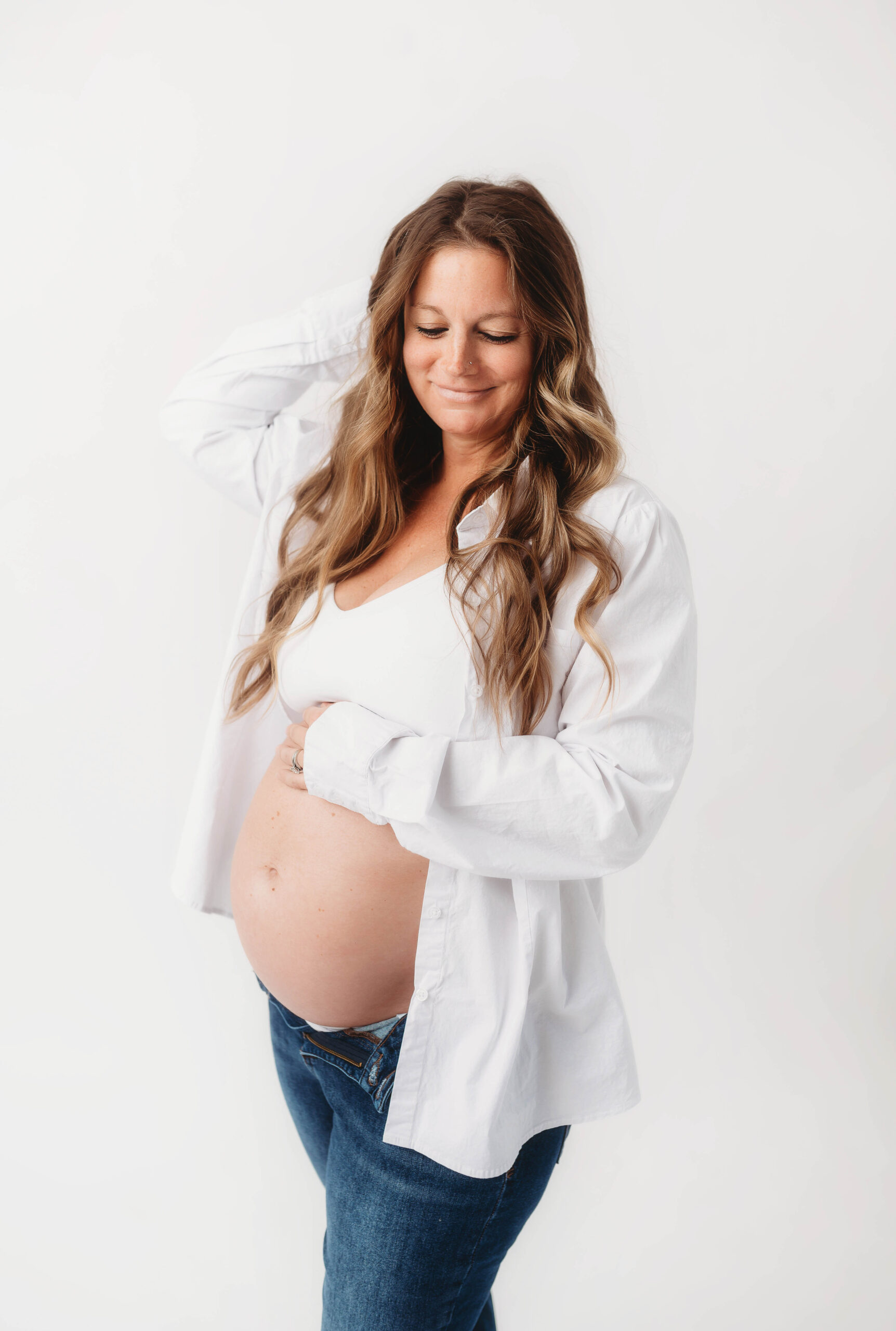 Expectant mother poses for Maternity Photos in Asheville, NC Maternity and Newborn Photography Studio.