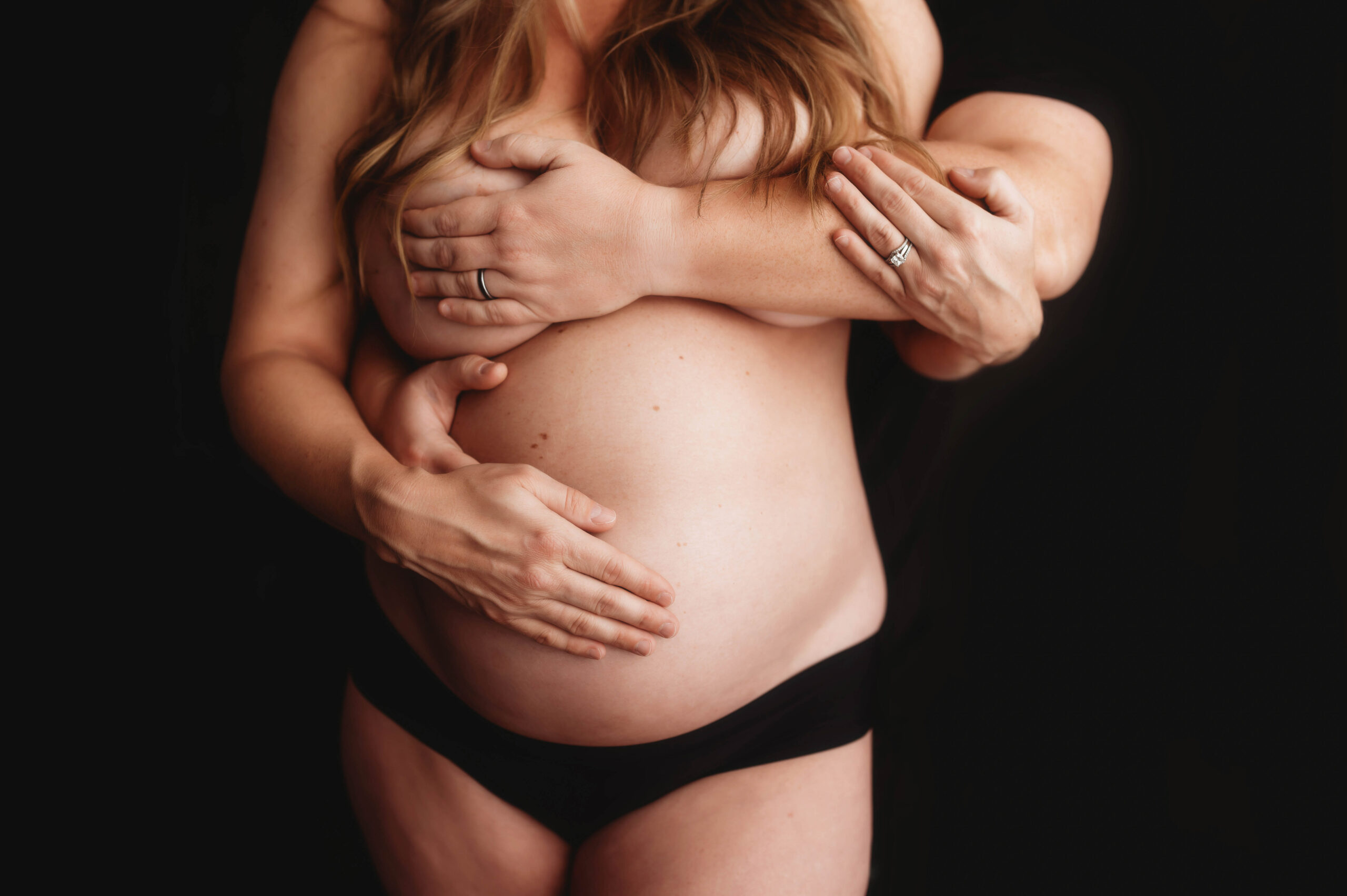 Expectant parents pose for Studio Maternity Portrait Session in Asheville, NC.