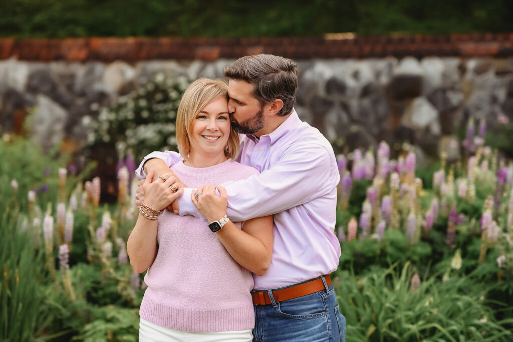 Parents embrace during Family Photoshoot at Biltmore Estate in Asheville, NC. 