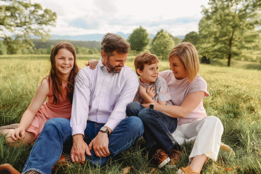 Parents laugh with their children during Family Photoshoot at Biltmore Estate in Asheville, NC. 