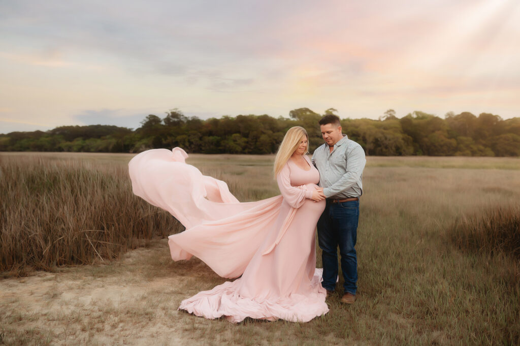Expectant Parents pose for Maternity Photos in Asheville, NC after receiving fertility treatment from the Best Fertility Specialists in Asheville. 