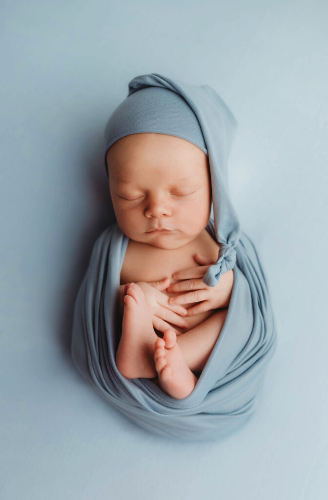 Asheville Newborn Photography Studio provides the Best Newborn Photos in Asheville. Portrait of a Newborn Baby boy posed for his Infant Photoshoot in Asheville.