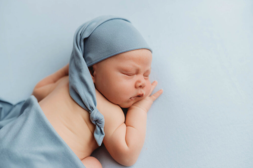 Asheville Newborn Photography Studio provides the Best Newborn Photos in Asheville. Portrait of a Newborn Baby boy posed for his Infant Photoshoot in Asheville.