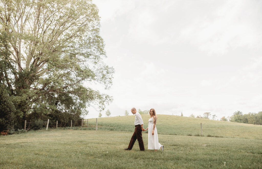 Newly Engaged Couple poses for Biltmore Estate Engagement Photos with Asheville Portrait Company in Asheville, NC