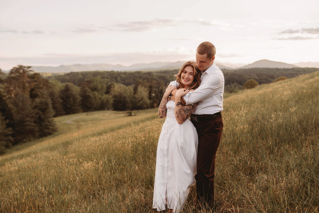 Newly Engaged Couple poses for Biltmore Estate Engagement Photos with Asheville Portrait Company in Asheville, NC