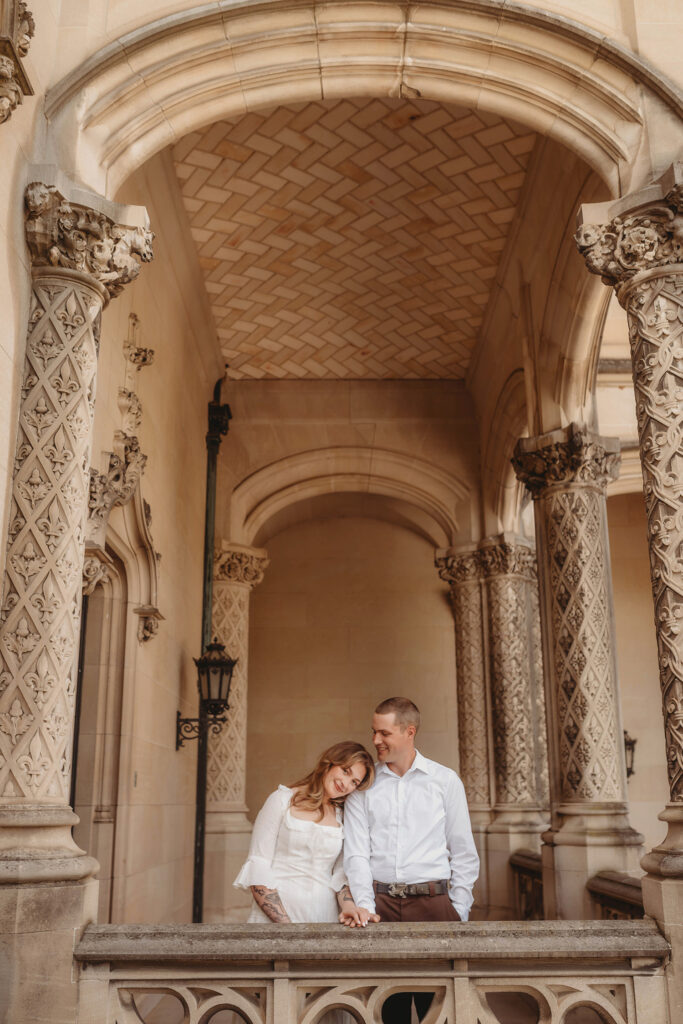 Newly Engaged Couple poses for Biltmore Estate Engagement Photos with Asheville Portrait Company in Asheville, NC