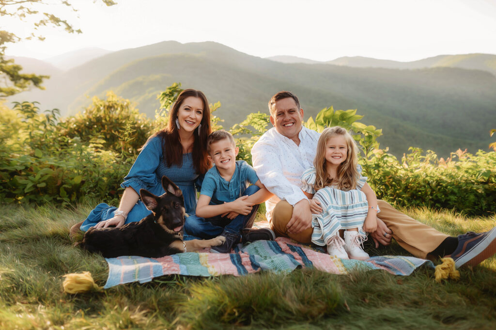 Family poses for Family Photos on the Blue Ridge Parkway in Asheville, NC. 
